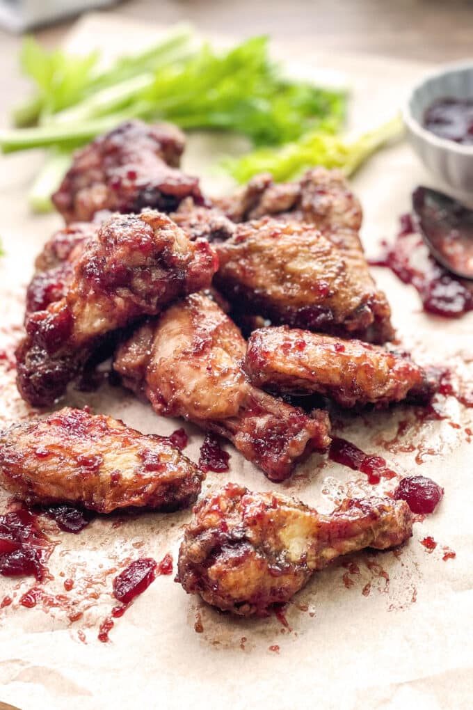 Chicken wings with a cranberry sauce coating.