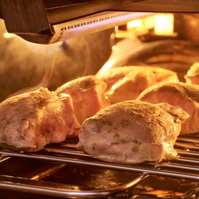 Chicken thighs under the broiler to sear.