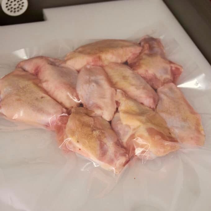 Raw chicken wings sealed in sous vide bag.