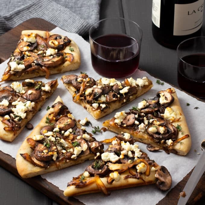 Mushroom flatbread pizza with goat cheese and onions.