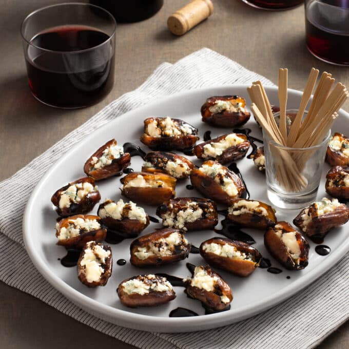 Dates stuffed with cheese and drizzled with balsamic.