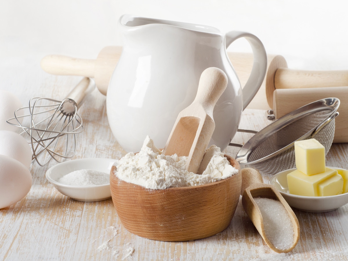 baking ingredients in white and wooden containers
