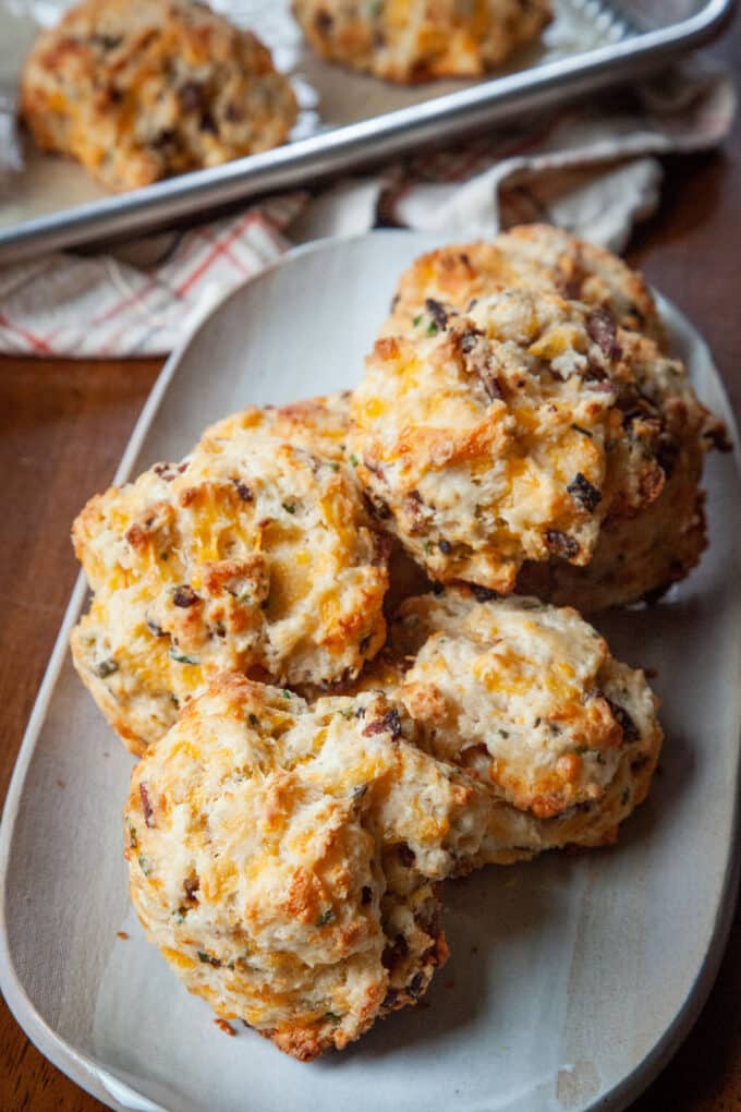 drop biscuits with bacon, chives, and cheese on a platter
