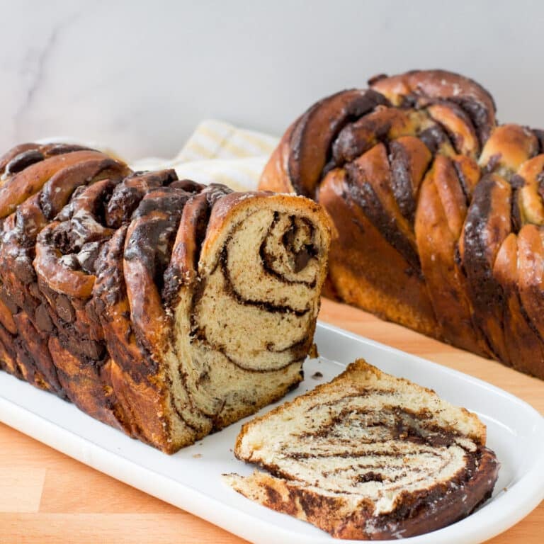 Chocolate babka loaf with slice cut.