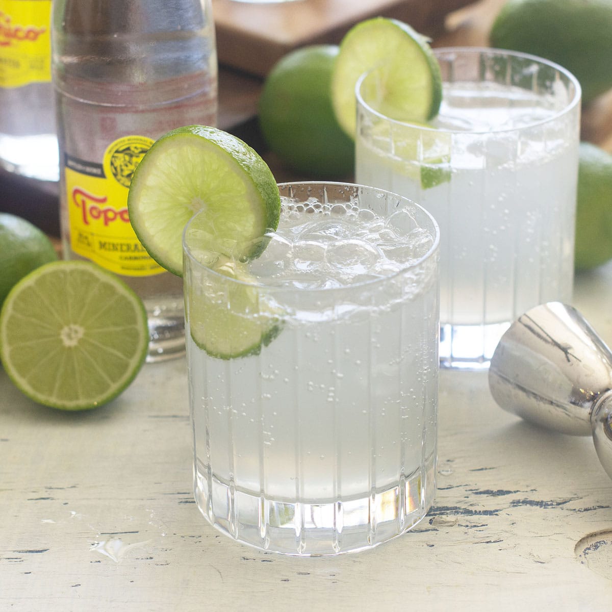 Ranch water cocktail in rocks glass with lime.