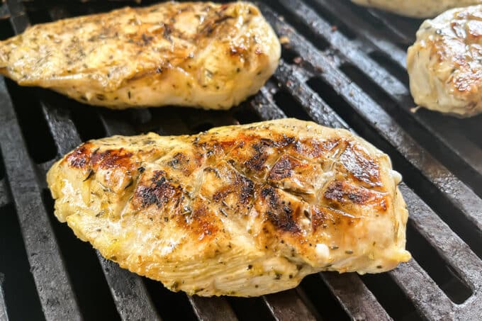 Greek marinated chicken breasts on the grill.
