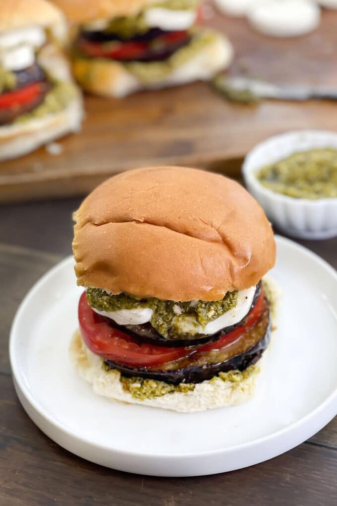 Mediterranean Eggplant Burger with tomato, mozzarella, and pesto.