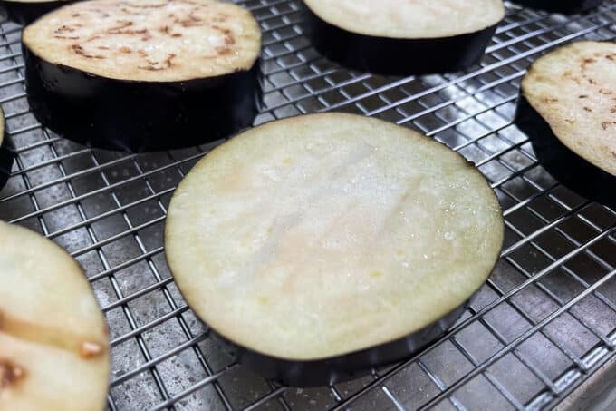 Moisture being drawn out of salted eggplant slice.