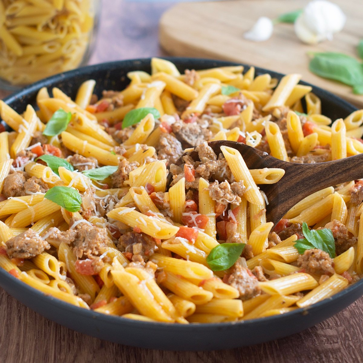 Skillet of ground turkey pasta with creamy tomato sauce.