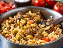 Pot of macaroni with ground beef, tomatoes, and cheese.