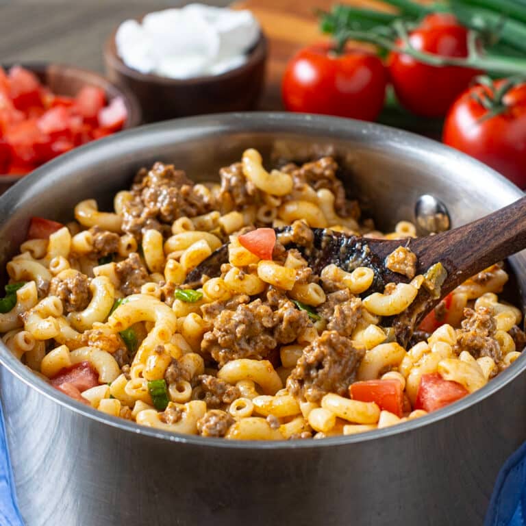 Pot of macaroni with ground beef, tomatoes, and cheese.