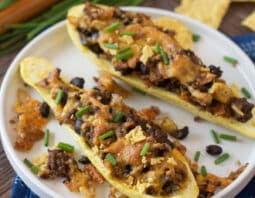 Yellow squash halves stuffed with ground beef taco mixture and topped with cheese.