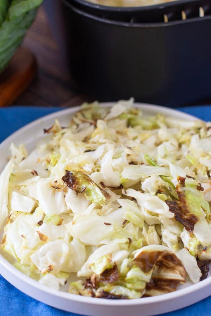 Plate of tender caramelized chopped cabbage.