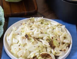 Plate of tender caramelized chopped cabbage.