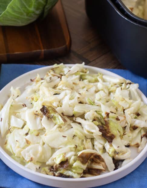 Plate of tender caramelized chopped cabbage.