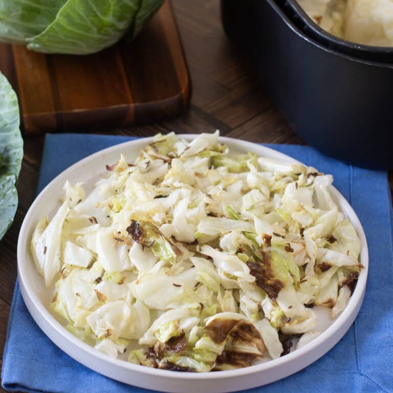 Plate of tender caramelized chopped cabbage.