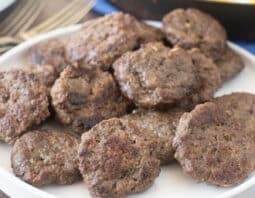 White plate with beef breakfast sausage patties.