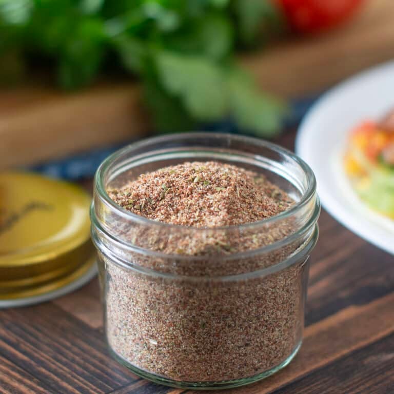 Glass jar of homemade chicken taco seasoning.