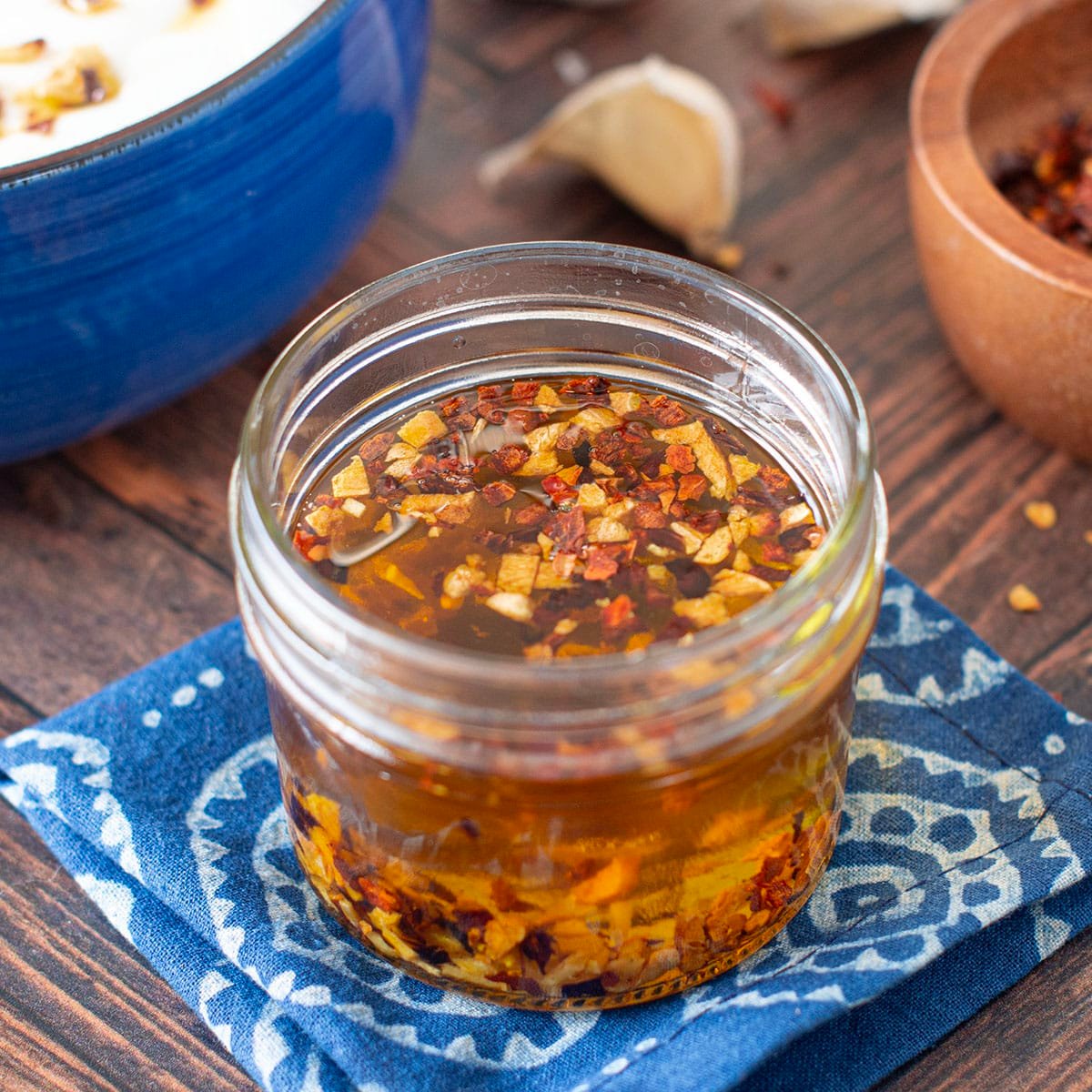 Glass jar with homemade garlic chili oil.