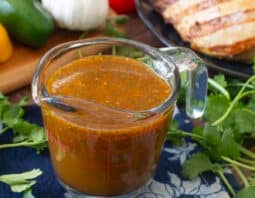 Glass measuring cup of Mexican chicken marinade.
