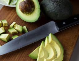 Avocados cut in half, slices, and cubes.