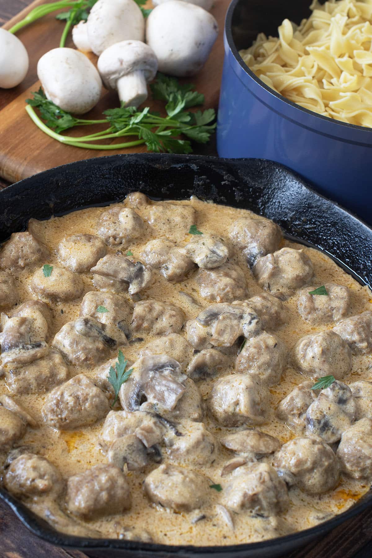 Pan of meatballs in creamy mushroom sauce.