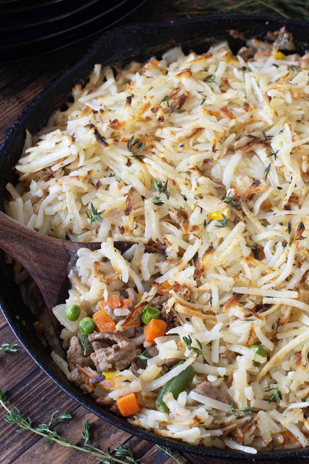 Ground turkey skillet meal topped with shredded potatoes.