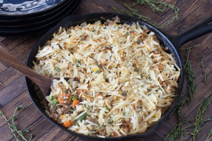 Ground turkey skillet meal topped with shredded potatoes.