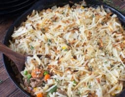 Ground turkey skillet meal topped with shredded potatoes.